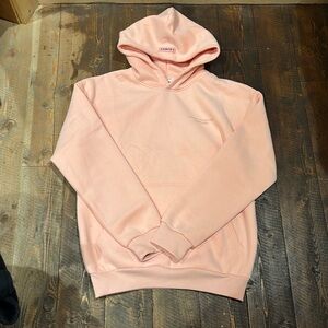 comfrt pink/ peach hoodie. NEVER WORN, size small, it’s in new condition.